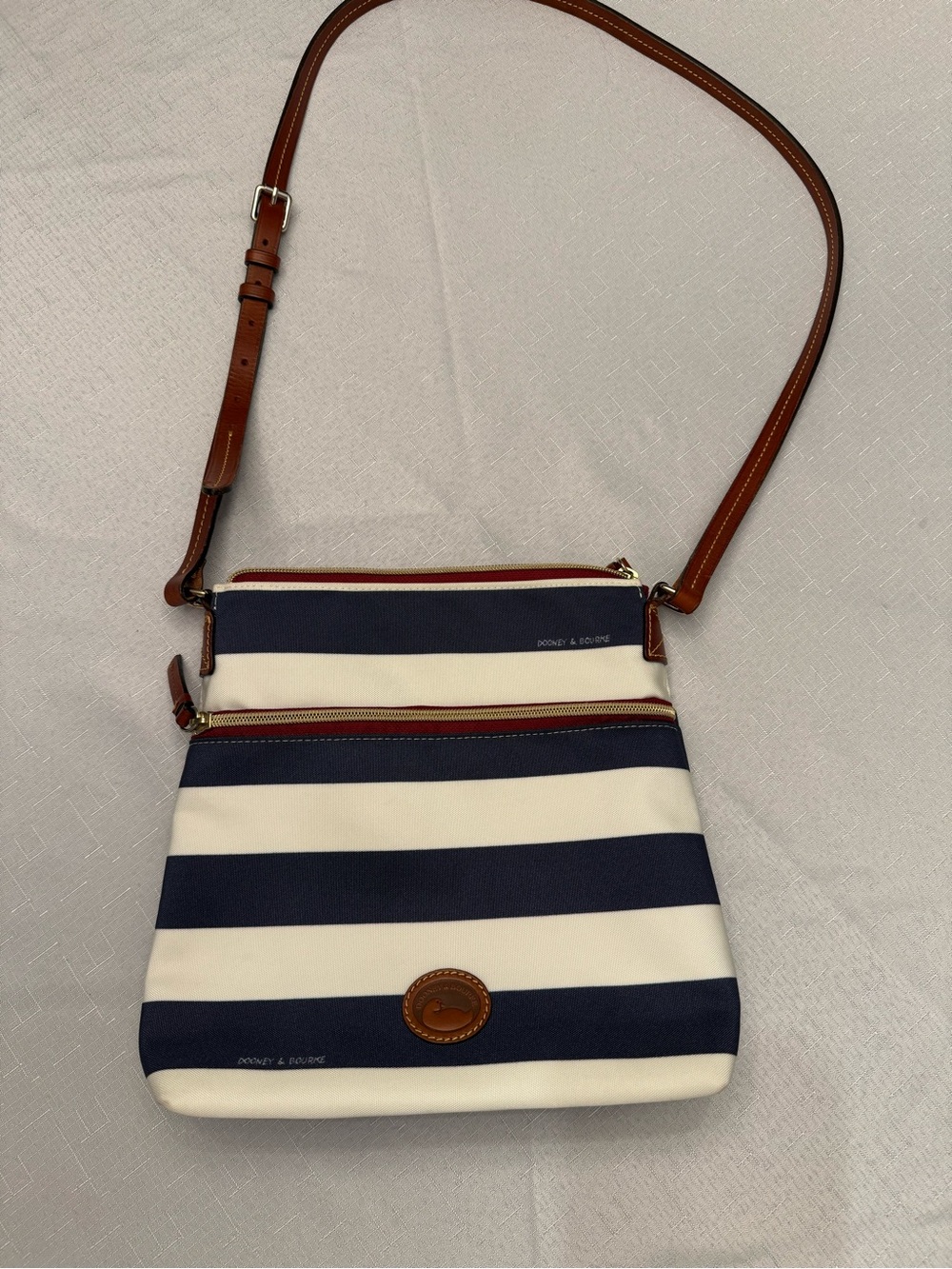 Dooney & Bourke Navy and White Striped Crossbody with Brown Leather Strap